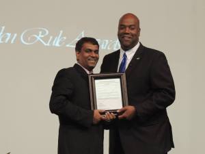 Dr Peppe receives Golden Rule Award from Dr. Clyde Rivers Director of the North American Division of the IPI.